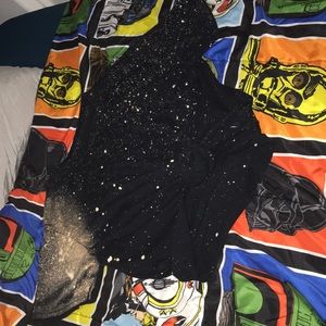 black shirt with dots of bleach